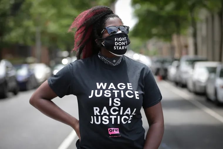Michelle Uche of One Fair Wage attends a rally as part of the national Strike for Black Lives in Philadelphia, Pa. on July 20, 2020. They are demanding the Senate pass the HEROES Act that provides PPE, essential pay and extended unemployment benefits.