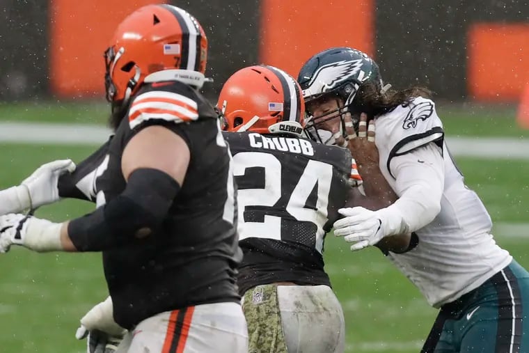 Cleveland Browns running back Nick Chubb shoves off defensive end Joe Ostman during the fourth quarter on Sunday.