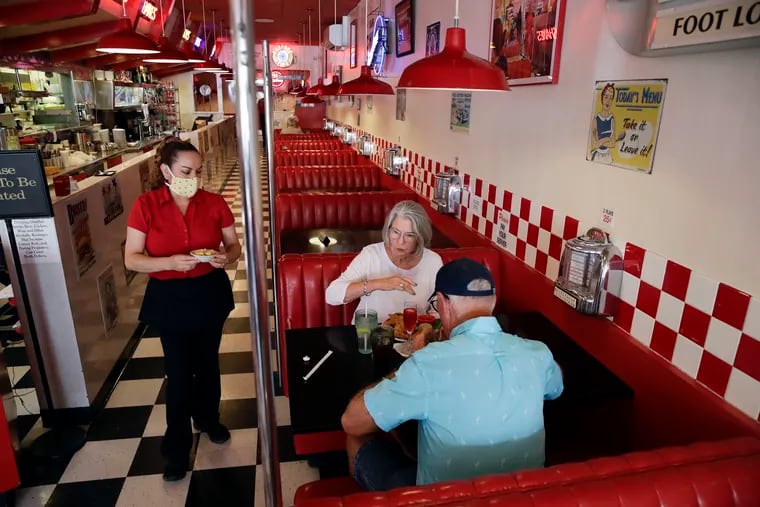 In some states where indoor dining has been allowed, like the Busy Bee Cafe in Ventura, Calif., back in May, social distancing is observed, but that may not be enough to stop the virus. California has since declared indoor dining to be off-limits.
