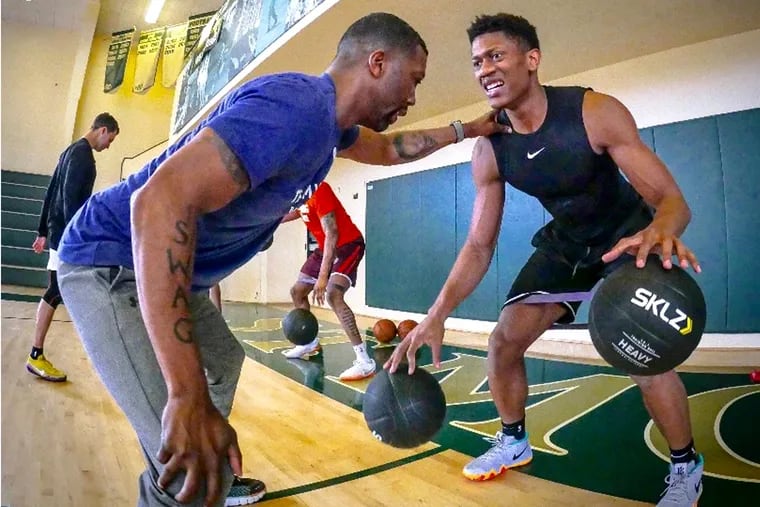 De'Andre Hunter (right) works out with Sean Colson.