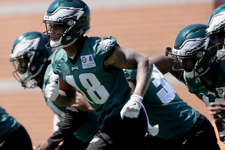 Eagles' Shelton Gibson, left, warms-up during the last day of the Eagles three-day mandatory minicamp in Philadelphia, PA on June 13, 2018. DAVID MAIALETTI / Staff Photographer