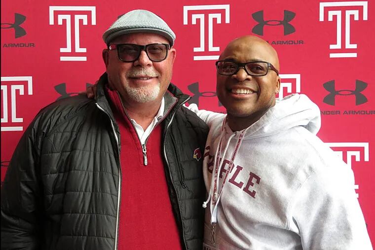 Former Temple and Arizona Cardinals head coach Bruce Arians reunites with RB Paul Palmer during the Owls alumni day.