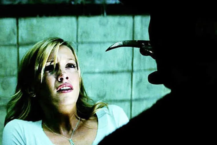 Katie Cassidy stars as Kris Fowles and Jackie Earle Haley stars as Freddy Krueger in "A Nightmare on Elm Street (2010)." (Warner Bros. Pictures)