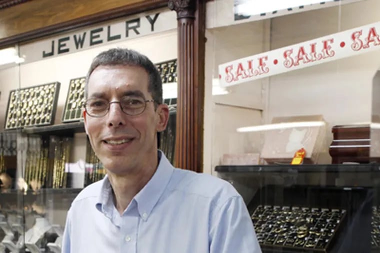 Victor Ostroff at his family store, A.I. Poland Jewelers, on the same spot since 1899. The store is closing July 4. (Laurence Kesterson / Staff Photographer)