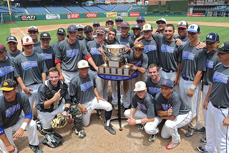 The Suburban One League National team surrounds the Carpenter Cup
after beating Jersey Shore 12-6 June 23, 2015 to win the championship
at Citizens Bank Park.  ( CLEM MURRAY / Staff Photographer )