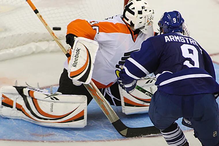 Maple Leafs' Colby Armstrong scores on Flyers goalie Sergei Bobrovsky during a shootout. (AP Photo/The Canadian Press, Dave Chidley)