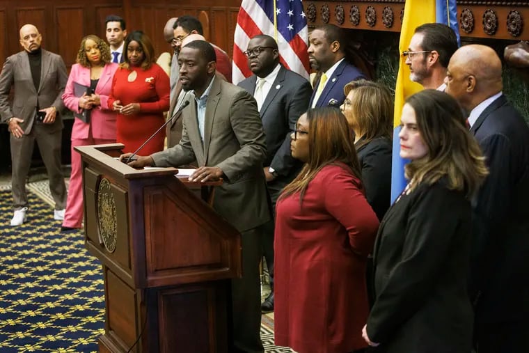 Councilmember Isaiah Thomas, chair of City Council’s Education Committee, surrounded by local and state elected officials and Philadelphia School District union officials, speaks Monday at a news conference. The officials gathered to demand the Philadelphia School District come up with a plan on how to deal with its myriad building issues. The call was sparked by damaged asbestos closing two Philadelphia schools.