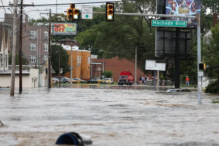 MacDade Blvd near Main Street was closed as flood waters spilled into the streets in Darby, PA on August 13, 2018.