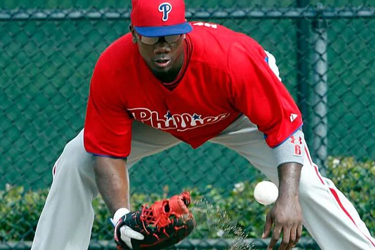 Phillies' Ryan Howard fields a ground ball during Spring Training workouts in Clearwater, FL on Wednesday, February 13, 2013. (Yong Kim/Staff Photographer)