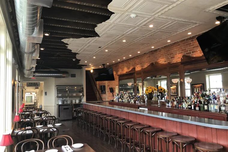 First-floor bar at Pineville Fishtown, 2448 E. Huntingdon St., features an artfully cut tin ceiling as a design feature.
