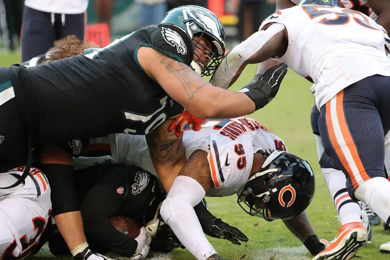 Eagles offensive guard Brandon Brooks, left, blocks on a fourth-quarter run play in Sunday's win over the Bears. The Eagles' offensive line controlled the line of scrimmage most of the day.