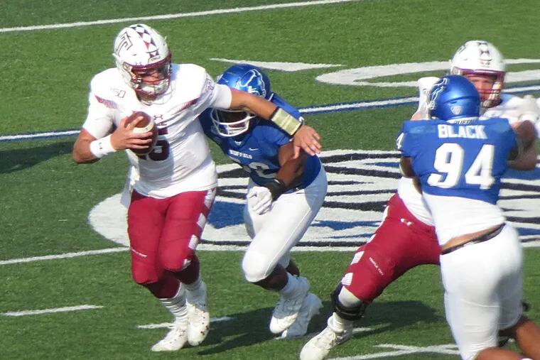 Temple's Anthony Russo can't escape Buffalo DE Ledarius Mack, who would cause a fumble on this play that was recovered by the Bulls Eric Black.