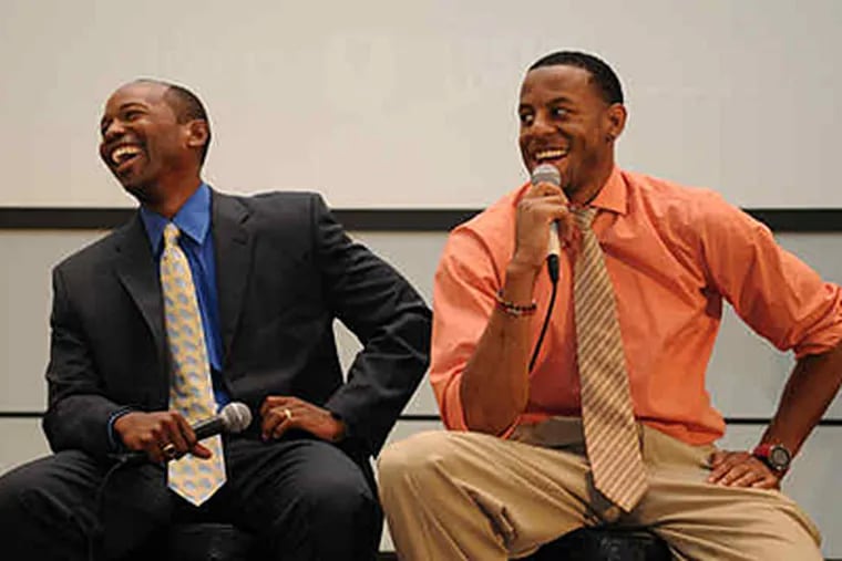 At symposium yesterday, Todd Ervin (left) and Andre Iguodala field questions from student athletes. (Kriston Bethel / Staff)