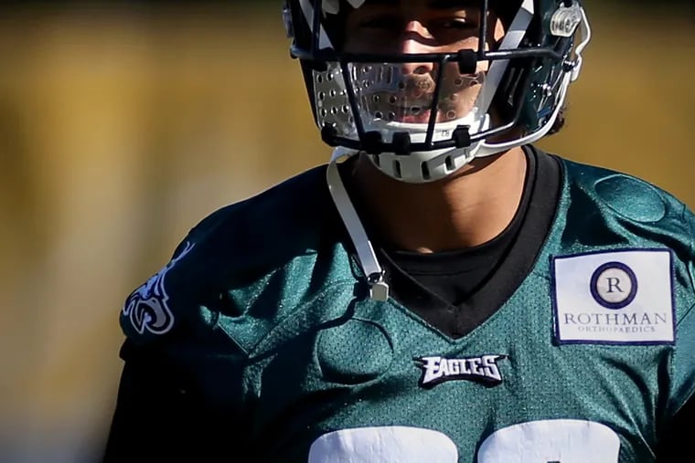 Eagles tight end Caleb Wilson wears a mouth shield Friday at practice. It is required to help reduce the spread of the coronavirus during workouts the NovaCare Complex in South Philadelphia.