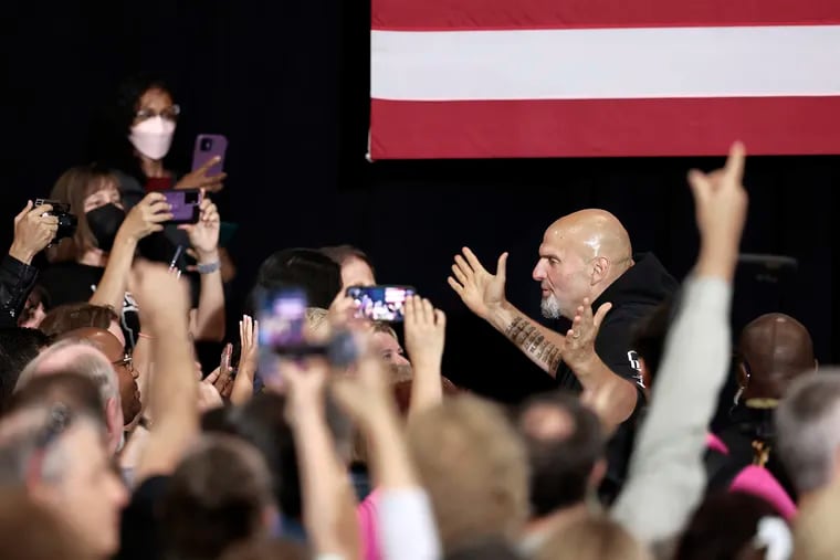 Lt. Gov. John Fetterman poses for photographs as he meets supporters after a rally in Blue Bell.