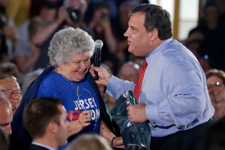New Jersey Gov. Chris Christie thanks Elaine Konopka after she gave him a fleece jacket during a town hall gathering in Sayreville, N.J., Thursday, May 16, 2013, where he announced that some 350 homeowners in the central New Jersey towns of Sayreville and South River whose properties have flooded repeatedly will be eligible to sell their homes in the first phase of a new federally funded buyback program. Christie returned to the community of Sayreville on Thursday afternoon, which was heavily flooded during Superstorm Sandy, to announce the $300 million buyback. The money will be enough to buy back nearly 1,000 homes in targeted communities along the Raritan River, Passaic River basin and the Jersey Shore. (AP Photo/Mel Evans)