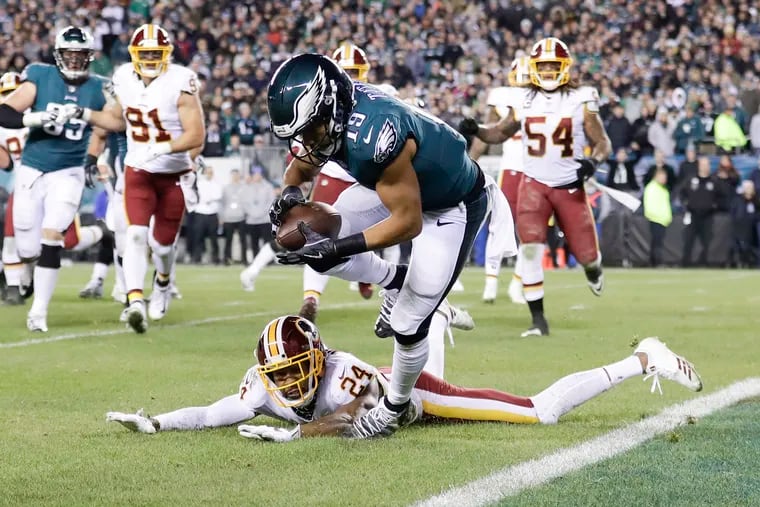 Golden Tate dives into the endzone for a two-point  conversion during the fourth quarter on Monday.
