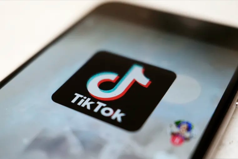 A September 2020 file photo shows the TikTok logo on a smartphone in Tokyo. Trading and investment firm Susquehanna International Group, which has offices in Bala Cynwyd, was an early investor in TikTok's parent company ByteDance. A lawsuit filed in Montgomery County alleges Susquehanna cut out two consultants from their share of that investment.  (AP Photo/Kiichiro Sato, File)