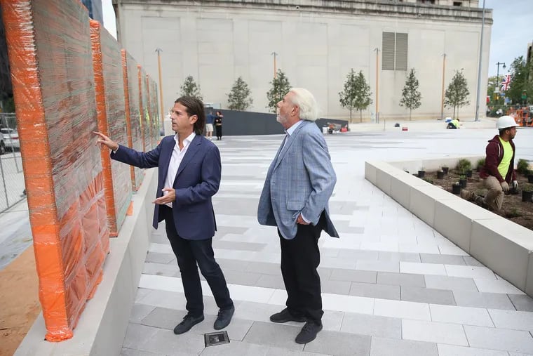 David Adelman, left, CEO of Campus Apartments and chairman of the Philadelphia Holocaust Remembrance Foundation, and Alan Horwitz, chairman of Campus Apartments and a donor to the new Holocaust Memorial Plaza along the Benjamin Franklin Parkway, talk about features of the new memorial plaza in Philadelphia on Friday, Oct. 5, 2018. .
