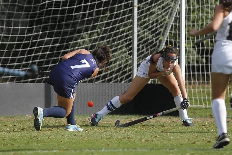 Villa Maria's Hannah Miller (7) scores as Merion Mercy's Caitlin Farkas defends in the first half of a girls high school field hockey game, Thursday Sept. 21, 2017, in Merion Pa.