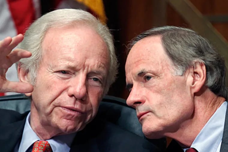 Sens. Tom Carper (right) and Joseph I. Lieberman during a hearing Tuesday on the U.S. Postal Service, which is facing default. Carper says it can delay that by using billions it prepaid on pensions. (J. Scott Applewhite / Associated Press)