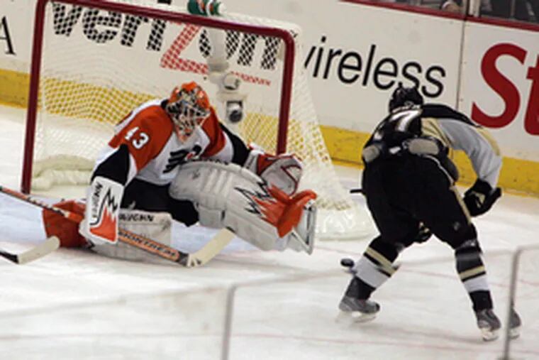 The Penguins&#0039; Petr Sykora burns goaltender Marty Biron during a busy first period in which the Flyers scored twice and Pittsburgh three times. Mike Richards scored the Flyers&#0039; goals.