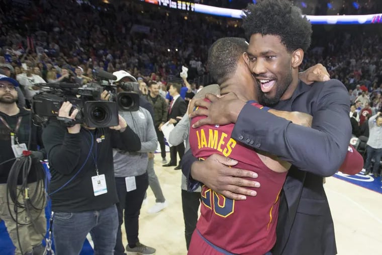 Joel Embiid (right) will likely restart his recruitment for LeBron James this summer.