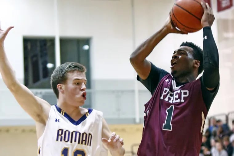 St. Joseph’s Prep guard Kyle Thompson puts up a shot while guarded by Roman Catholic’s Colin Flach during the second quarter of a Catholic League basketball quarterfinal Friday, Feb. 17, 2017 at Philadelphia University. Roman went on to win, 56-55.