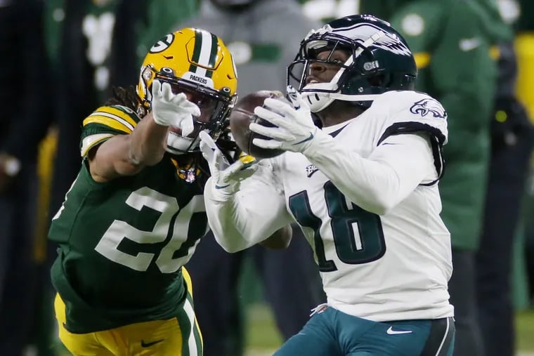 Jalen Reagor (18) catching a pass against Packers cornerback Kevin King in a recent game. Eagles wide receivers haven't combined for 100-plus receiving yards in a game since Week 8.