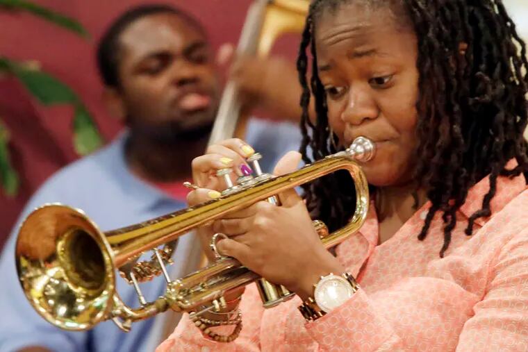 Arnetta Johnson on trumpet and Kendall Haskins on bass , both members of the Reginald Lewis Quintet and college students, play at Rochester's, a strip-mall restaurant in Lawnside.