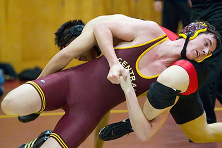 Central's Dylan Delaney drives Northeast's Michael Wang to the mat. (Ed Hille/Staff Photographer)