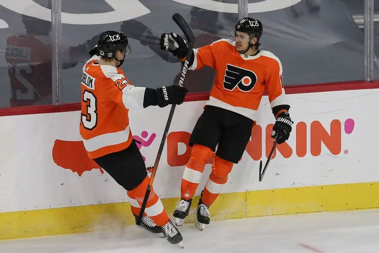 Travis Konecny (right) and Oskar Lindblom are among the six regular Flyers on the COVID-19 list who will miss at least the next two games.