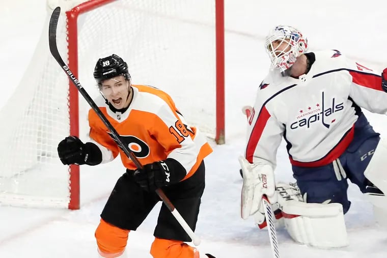 Flyers' 18 Tyler Pitlick celebrates the Flyers 2nd goal of the game as Capitals' goalie Braden Holtby gets up off the ice in the first period of the Washington Capitals' at the Philadelphia Flyers NHL game at the Wells Fargo Center in Phila., Pa, on January 8, 2019.