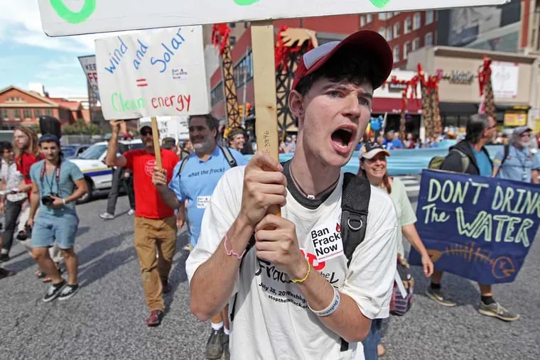 Protesters march around Philadelphia City Hall in 2012 during a shale-gas conference at the Pennsylvania Convention Center.
