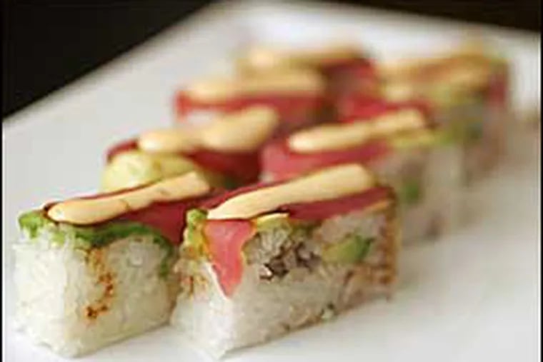 The square sushi with tuna shows the influence of Morimoto, where Wibisono worked the sushi bar for a year.