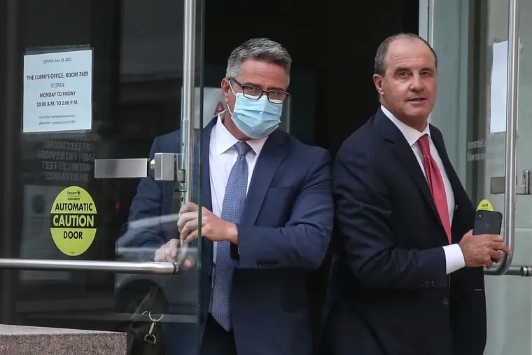 Councilperson Bobby Henon, left and his lawyer Brian McMonagle leave the Federal Courthouse in Philadelphia after jury selection in his bribery trial on Monday.