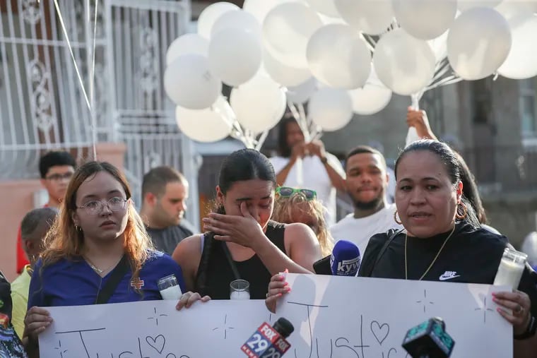 Family members of Eddie Irizarry including sister Maria Irizarry (left) and an aunt, Zoraida Garcia (right) speak to media as they gather on the block where he was killed for a balloon release in the Fairhill section of Philadelphia on Wednesday. Irizarry was shot and killed by a Philadelphia police officer Monday. Initially, police said Irizarry got out of his car and lunged at officers with a knife. A day later, police corrected their story and said Irizarry did not get out of the car or lunge at officers.