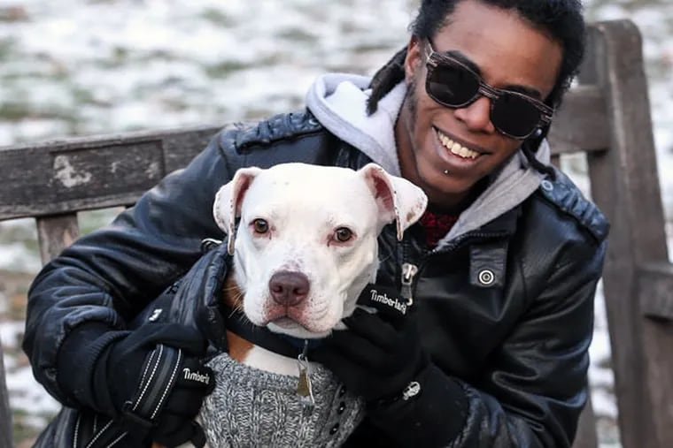 Tyler Williams, a Bryn Mawr alumnus who transitioned during his undergraduate years, is advocating for the admission of transgender women to the school. Williams is seen with his dog Dutchess.