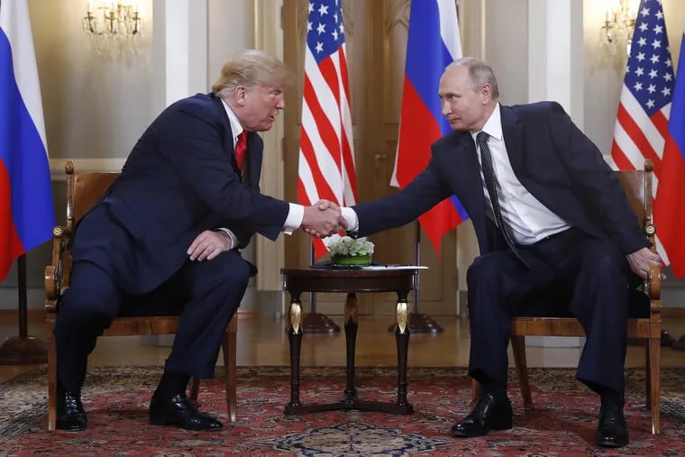 U.S. President Donald Trump, left, and Russian President Vladimir Putin shake hand at the beginning of a meeting at the Presidential Palace in Helsinki, Finland, Monday, July 16, 2018.