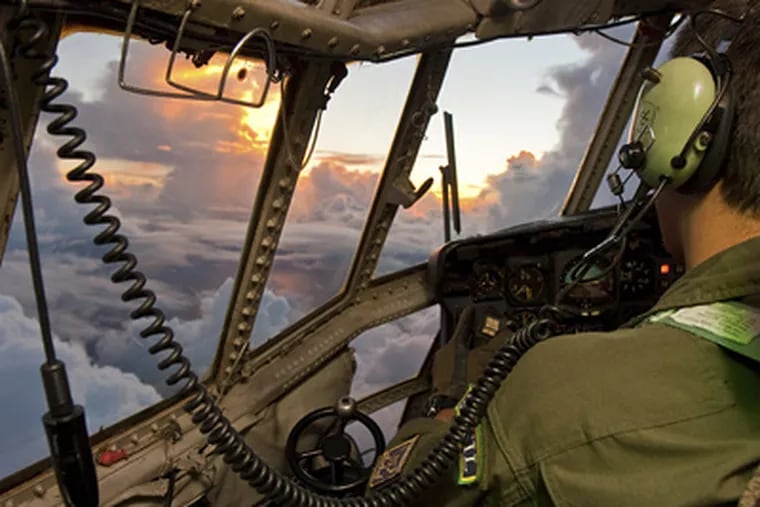 A pilot searches the Atlantic for the black box of audio recordings and flight data after Flight 447 was lost. (AP Photo/Johnson Barros, Brazilian Air Force)