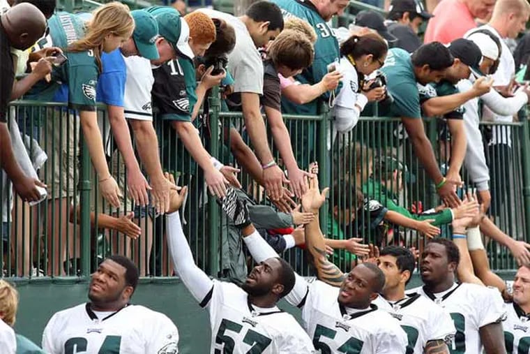 Thanks for the memories: Eagles greet their fans at Lehigh University at the end of camp in 2011. The team has decided to prepare for the 2013 season in South Philadelphia. STEVEN M. FALK / Staff Photographer