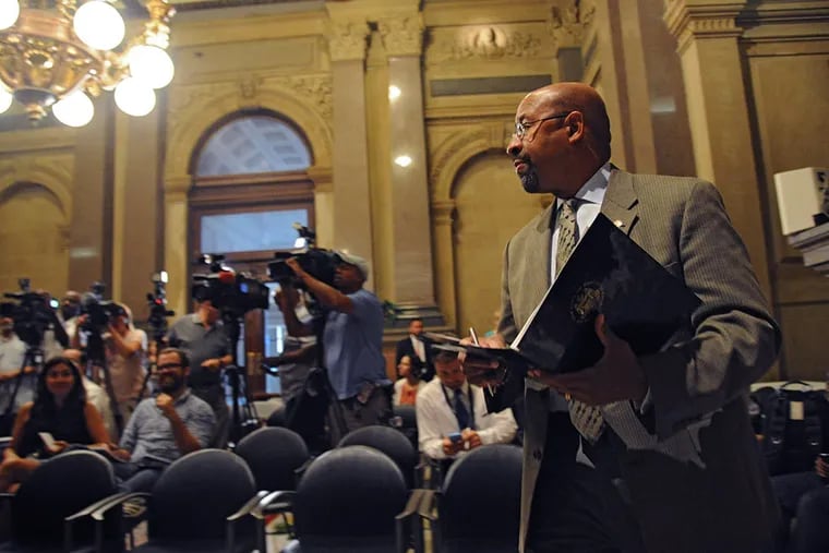 Mayor Michael Nutter walks into Conversation Hall in City Hall to speak about street closures and other security restrictions during Pope Francis' visit in September on July 27, 2015.  ( CLEM MURRAY / Staff Photographer )