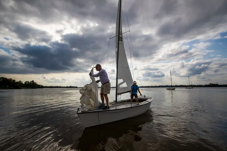 Coach Hugh Hutchinson (left) and Sky Mada head out on the Delaware River from the Riverton Yacht Club on Aug. 6, 2020