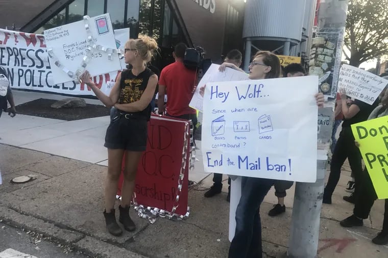 Protestors outside a fundraiser for Gov. Wolf say the mail policy is devastating family connections.