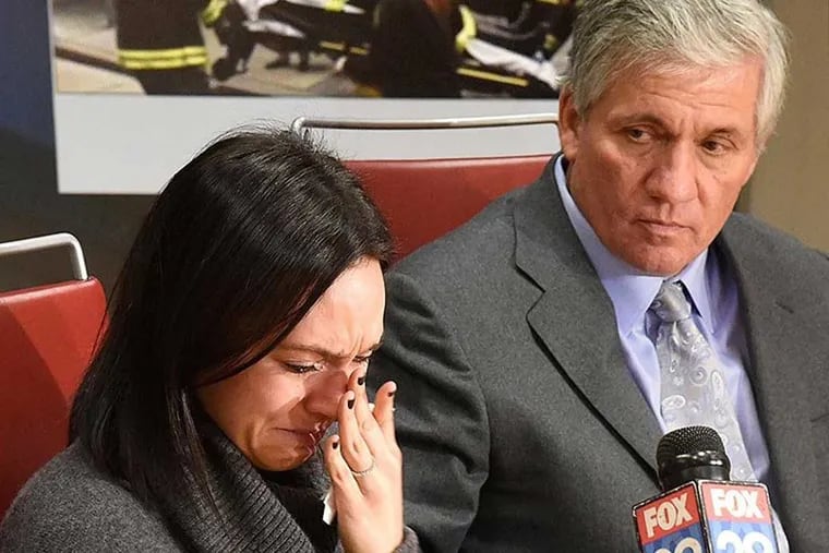 Allison Friedman (left) with her attorney Robert Mongoluzzi on Jan. 26, 2016, when they announced their suit against Pearl Properties. Friedman was injured when the roof of an adjacent building crashed on her while she was shopping at Lululemon at 1527 Walnut St.