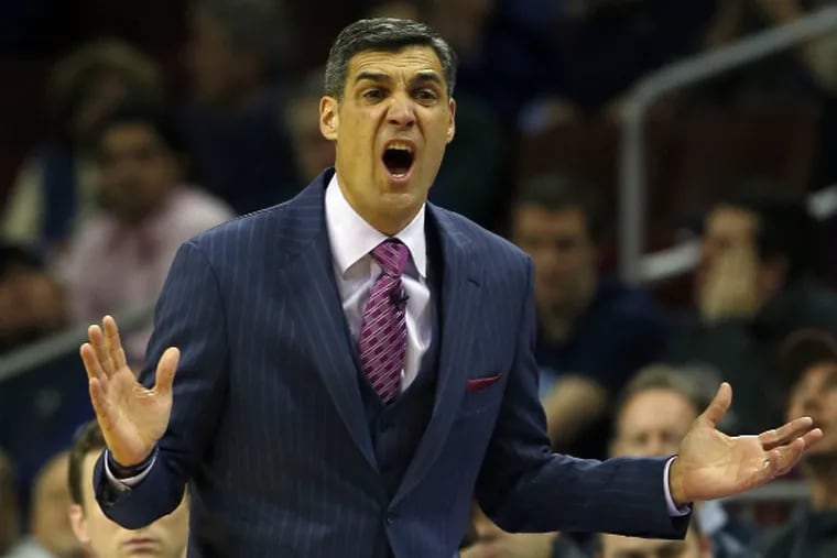 Coach Jay Wright yells to his Villanova players during the first half against Marquette. (Yong Kim/Staff Photographer)