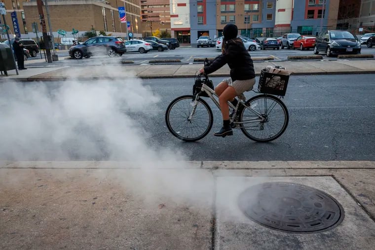 A cold Thursday morning raises steam from the street grates near 9th and Arch Streets Thursday.