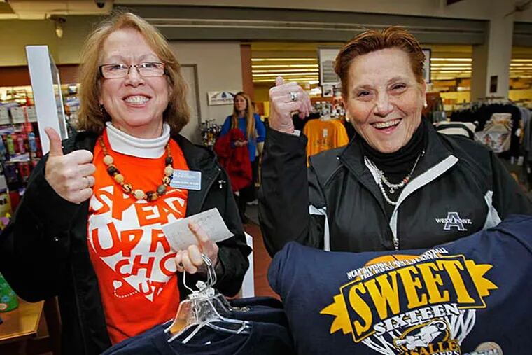 Kate Ward-Gaus (left) and Denise Pruskowski-Kavanagh show off their La Salle Sweet 16 garb. At right, Aiyana Pellegrino scored a Sweet 16 shirt at the campus store before supplies ran out. (Alejandro A. Alvarez/Staff)