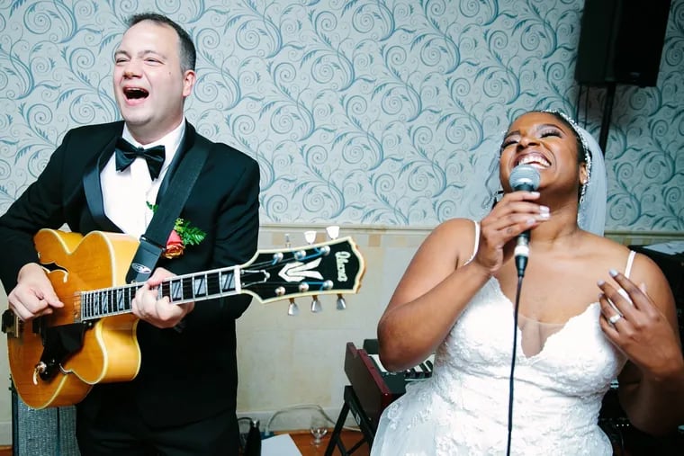 Michael Greco and Angela Williams perform for their wedding guests.