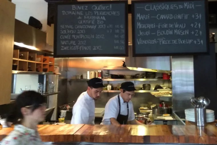 The open kitchen bustles at Le Clocher Pench&#0233;, a sunny corner bistro with a clear focus on local wines and ingredients.